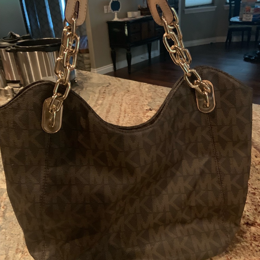Michael Kor’s large tote purse in brown logo print